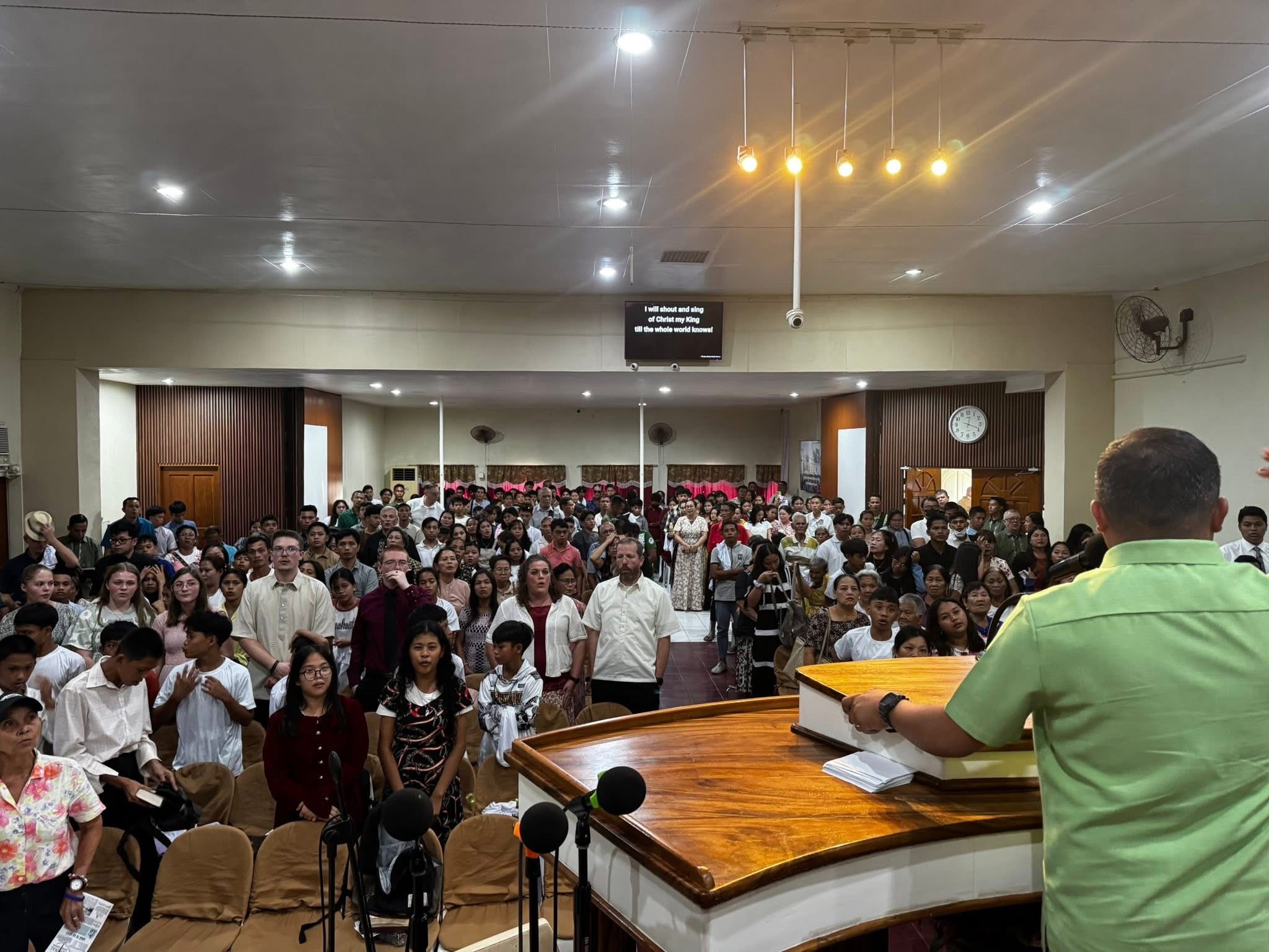 Congregation singing at International Baptist Church